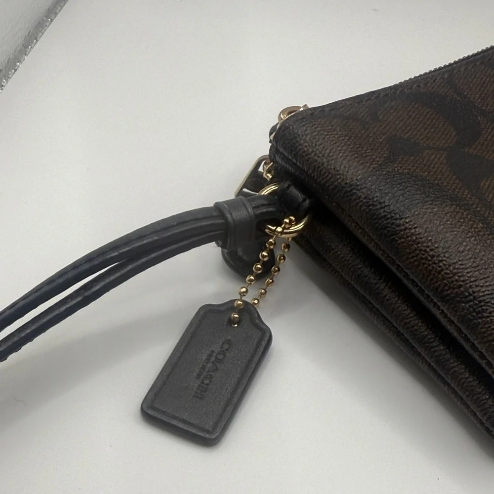 Coach signature‎ Brown Wristlet with Black and gold Accents